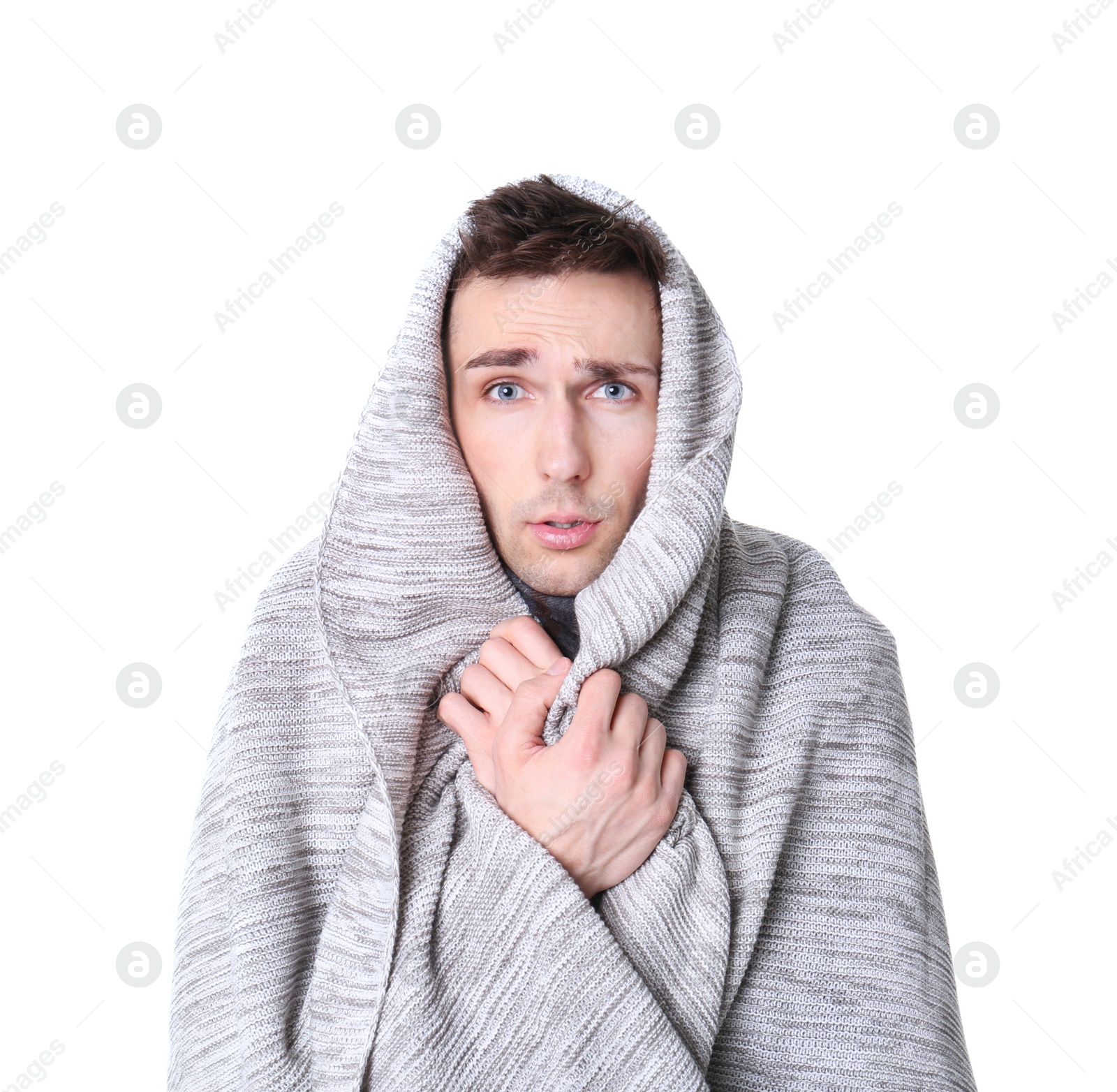 Photo of Young man with cold wrapped in blanket on white background