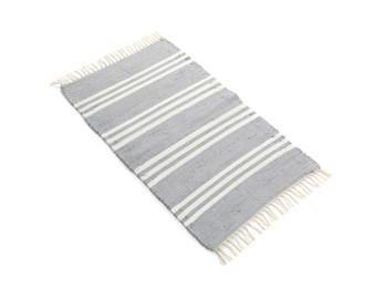Photo of Stylish light grey rug isolated on white. Interior accessory
