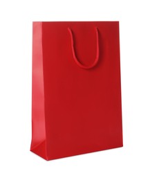 Photo of One red shopping bag isolated on white