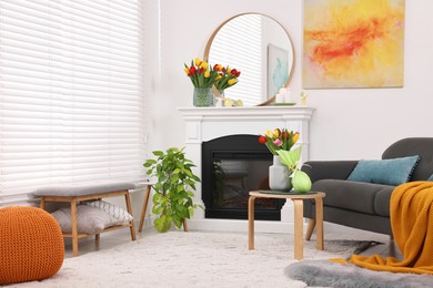 Photo of Beautiful Easter decorations and furniture in stylish room