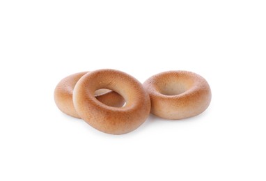 Photo of Tasty dry bagels (sushki) on white background