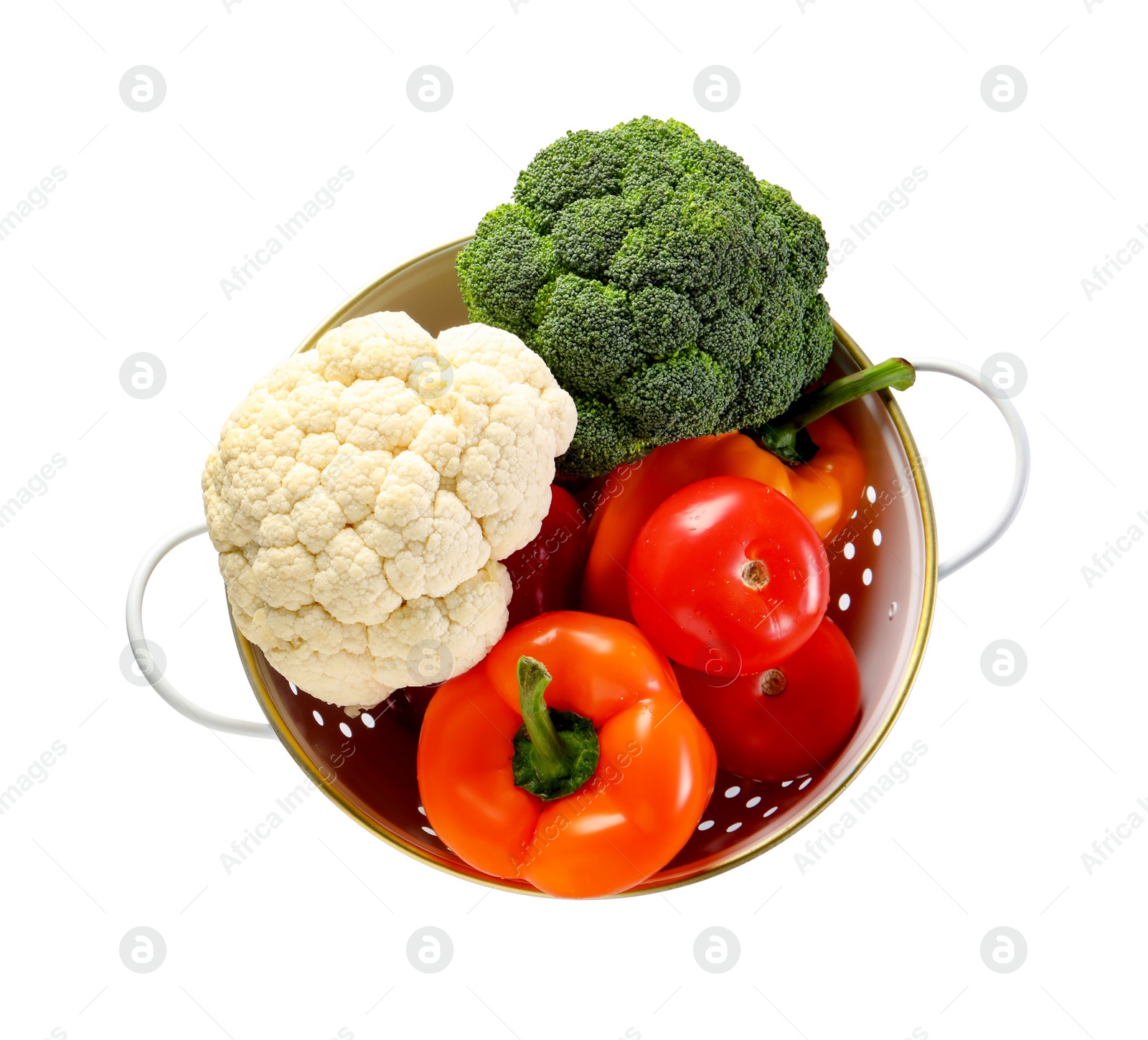 Photo of Colander with fresh vegetables isolated on white, top view