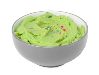 Photo of Bowl of delicious guacamole isolated on white