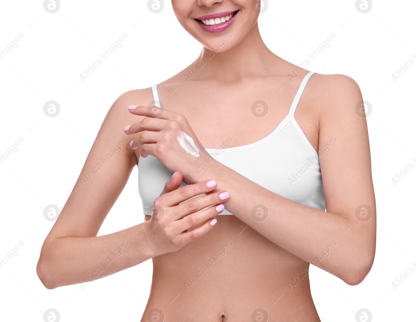 Photo of Woman with smear of body cream on her hand against white background, closeup