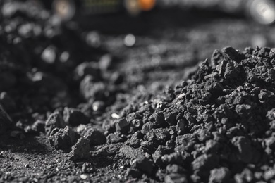 Closeup view of coal pile in field