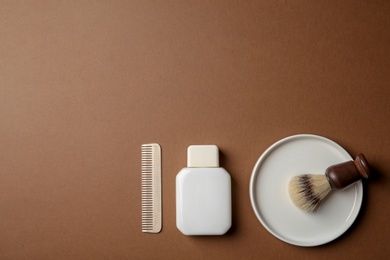 Flat lay composition with men's shaving accessories and space for text on color background