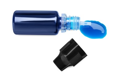 Photo of Bottle of blue food coloring on white background, top view
