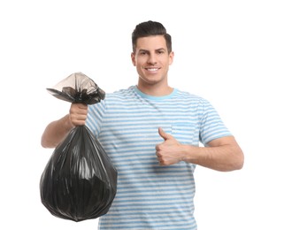 Man holding full garbage bag on white background