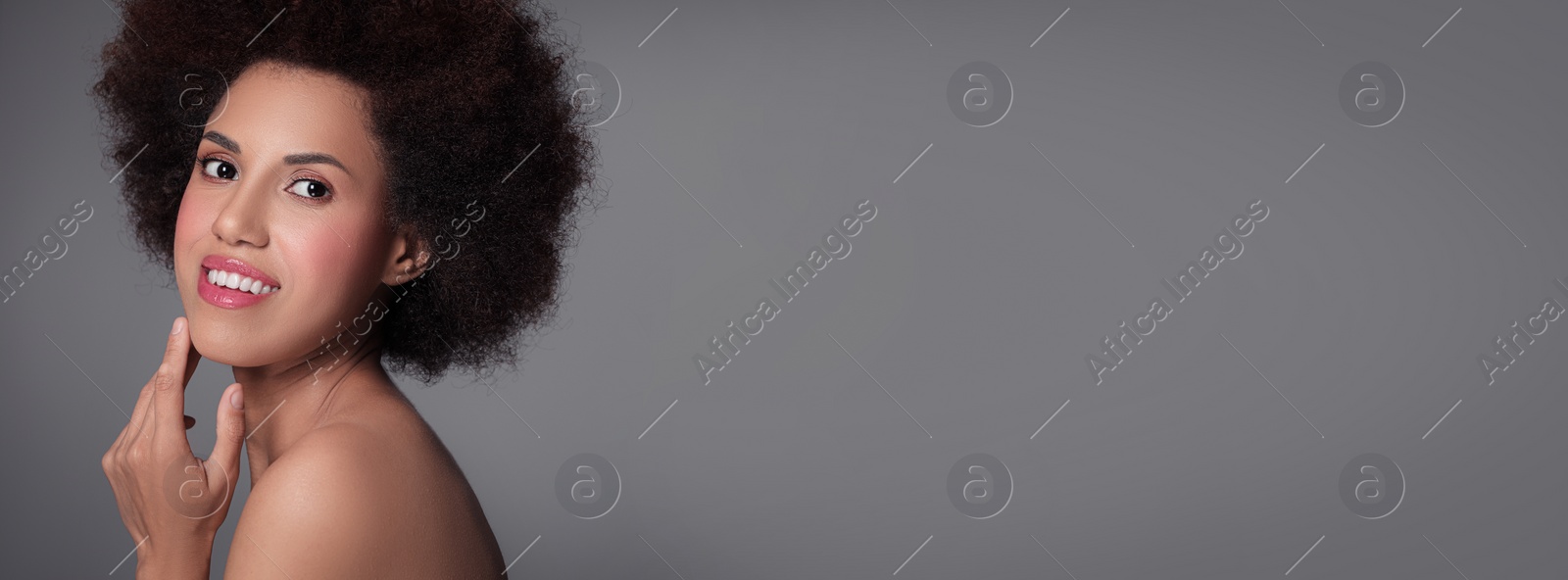 Image of Portrait of beautiful young woman on grey background. Banner design with space for text