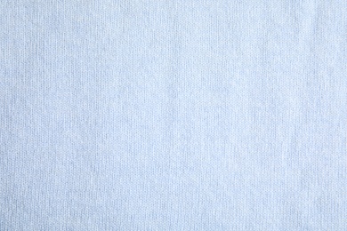 Photo of Warm cashmere sweater as background, top view