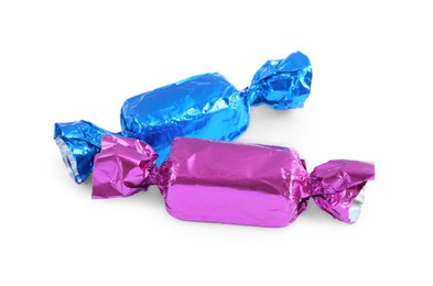 Photo of Two candies in colorful wrappers isolated on white