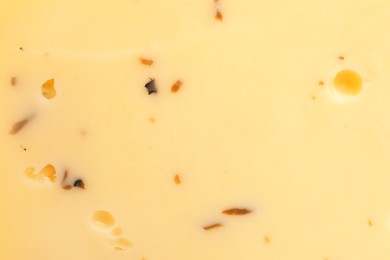 Delicious truffle cheese as background, closeup view