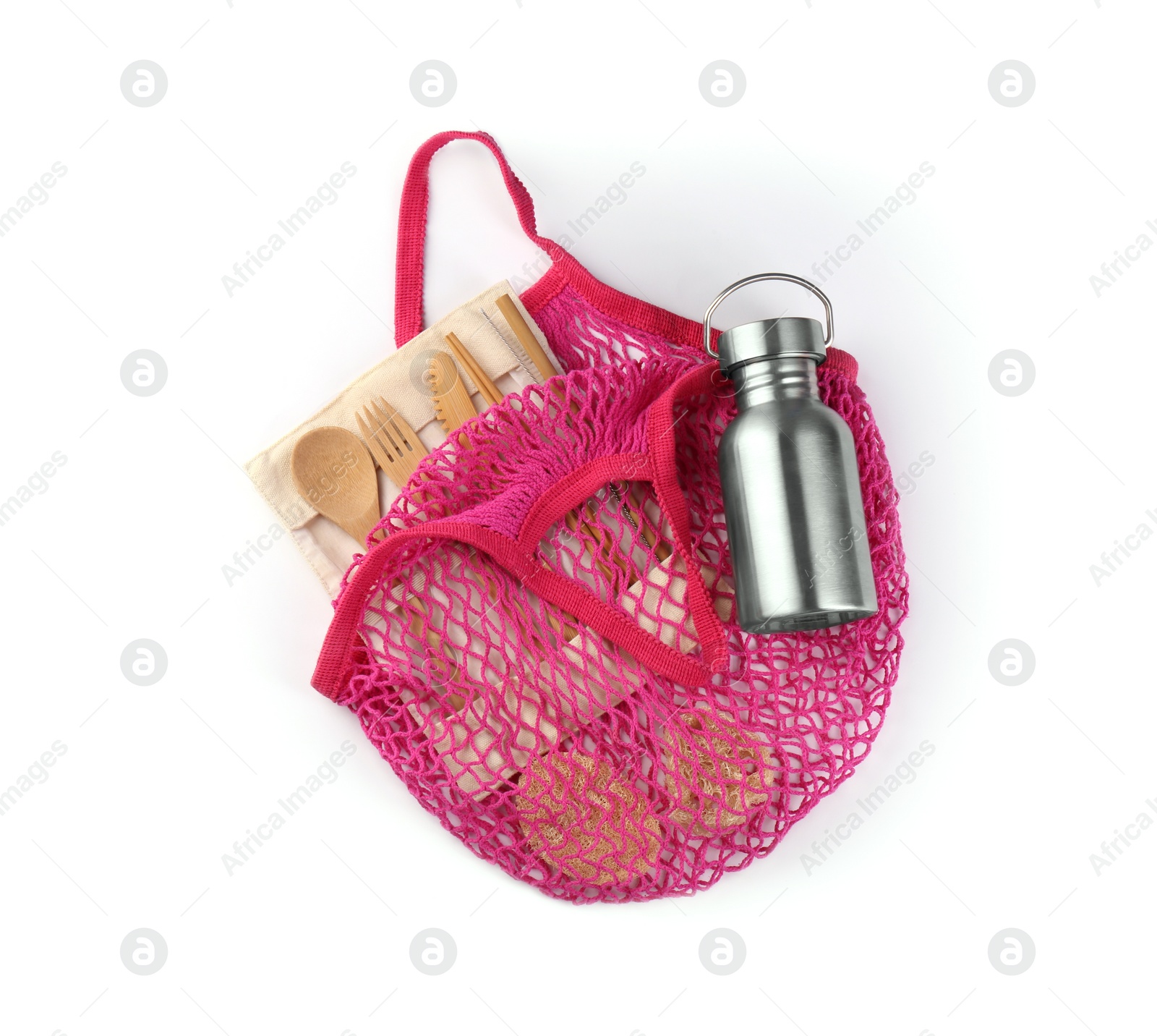 Photo of Mesh bag with different items isolated on white, top view. Conscious consumption