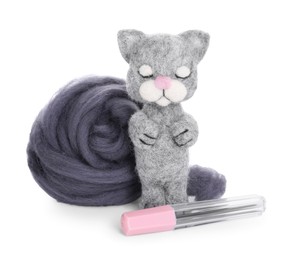 Photo of Needle felted cat, wool and tools isolated on white