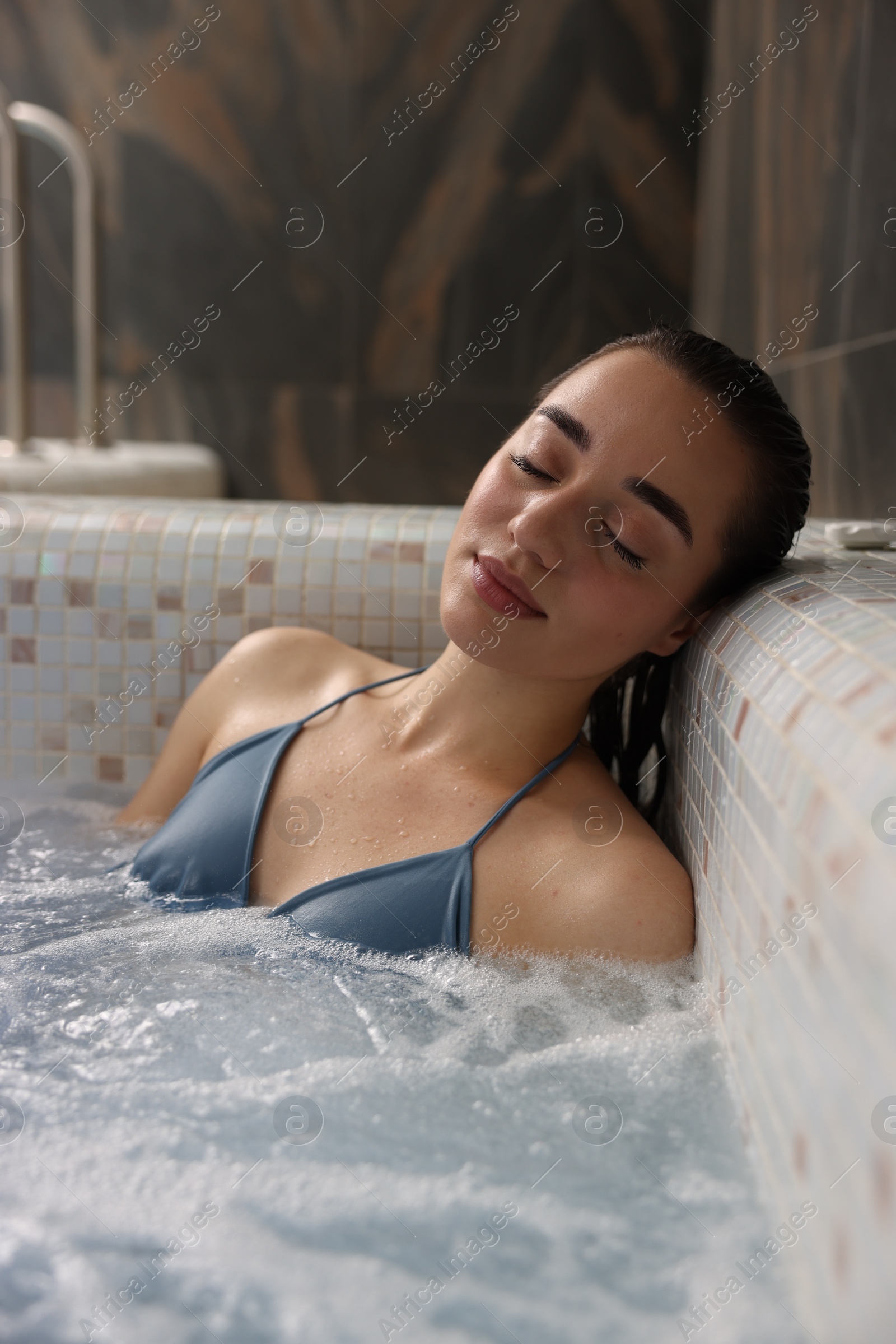 Photo of Beautiful woman relaxing in spa swimming pool