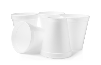 Photo of Many clean styrofoam cups on white background