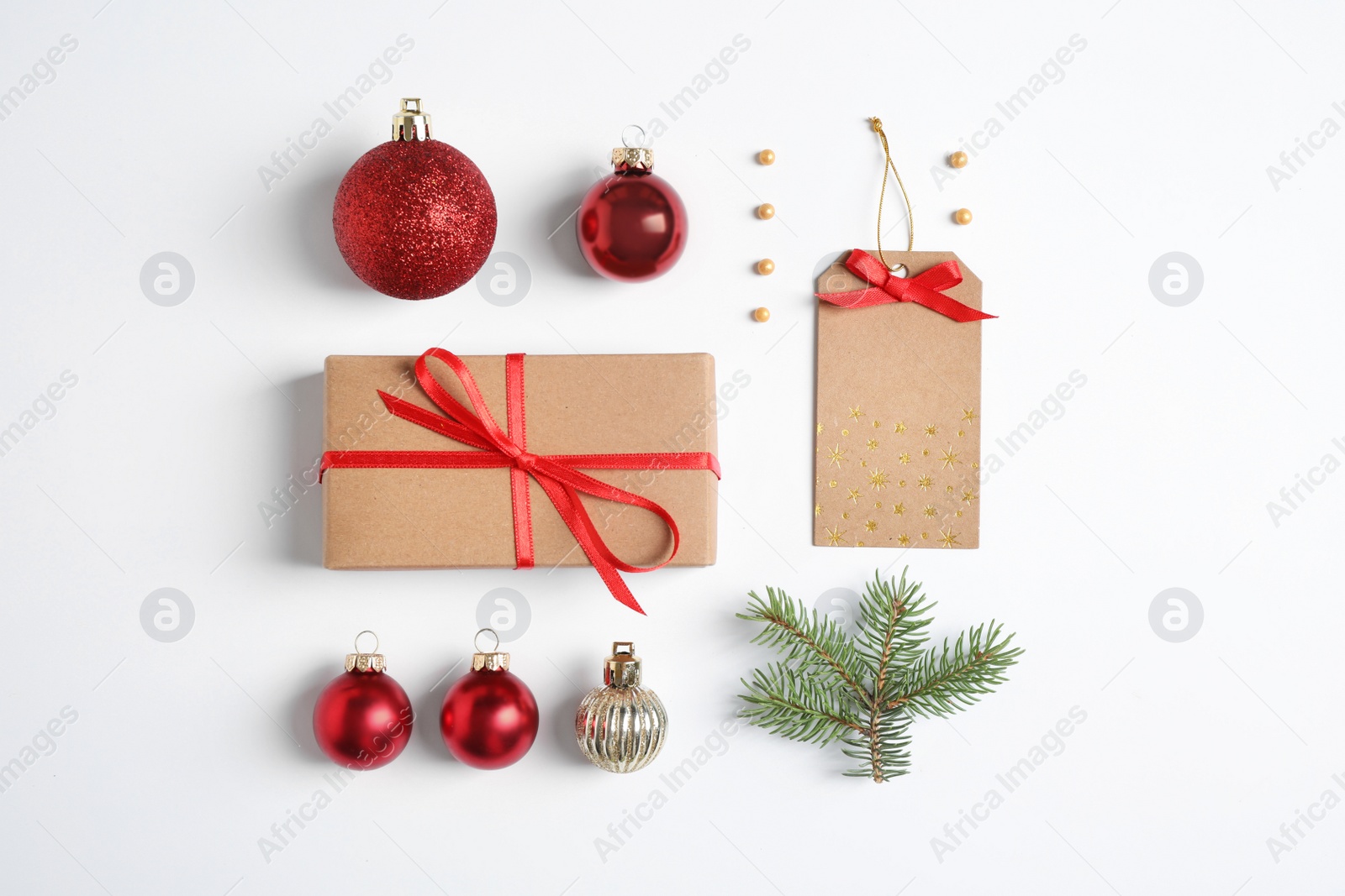 Photo of Fir tree branch with Christmas decoration on white background, top view