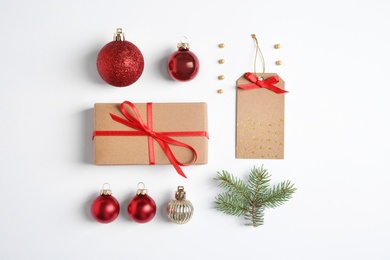 Fir tree branch with Christmas decoration on white background, top view