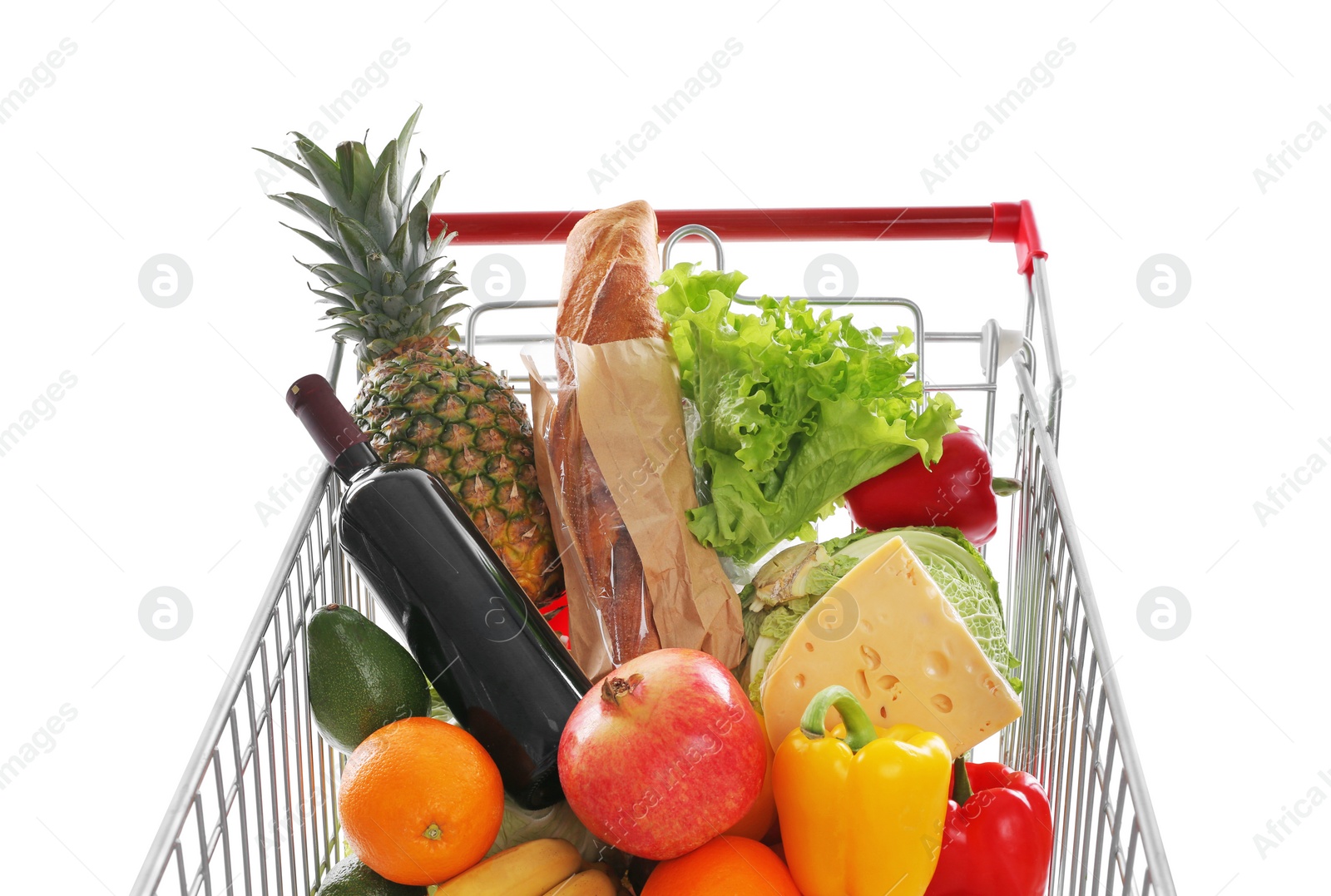 Photo of Shopping cart with groceries on white background, closeup