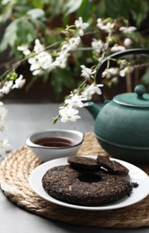 Photo of Composition with aromatic pu-erh tea on grey table