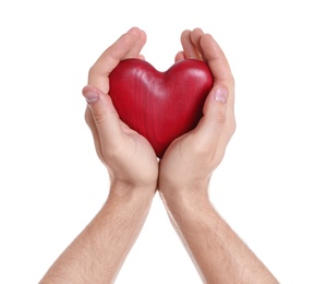 Photo of Man holding decorative heart in hands on white background, closeup