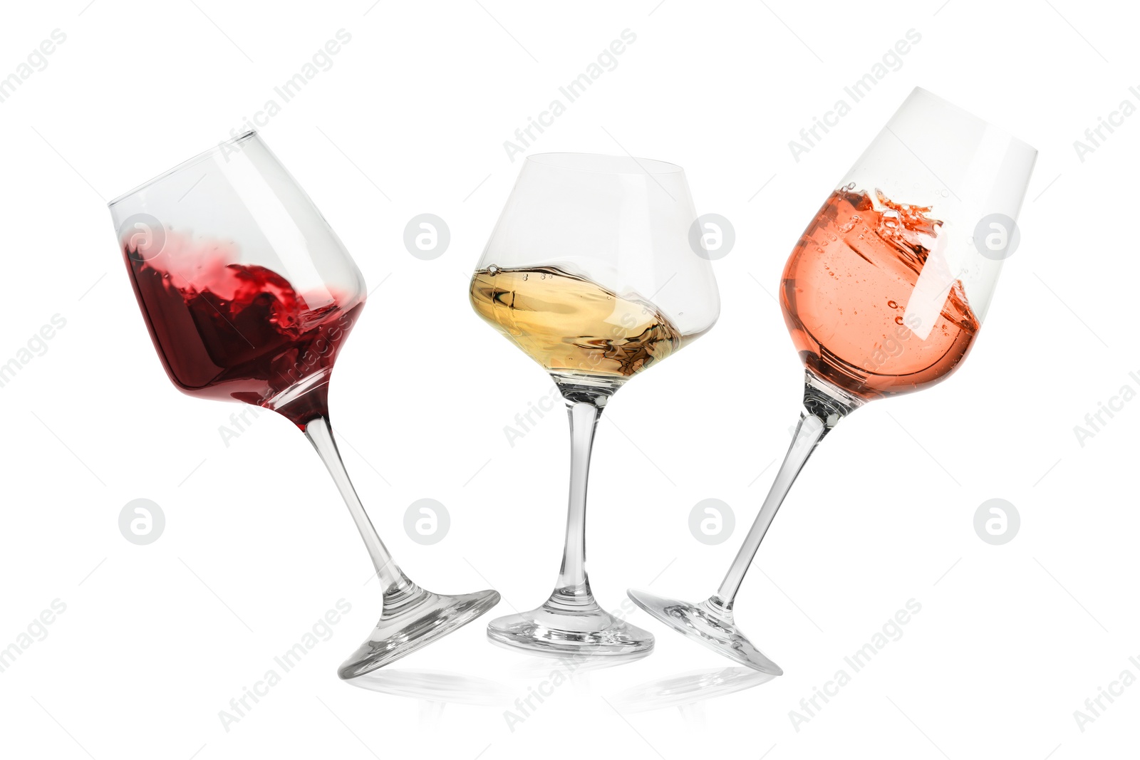 Image of Different types of wine splashing in glasses on white background