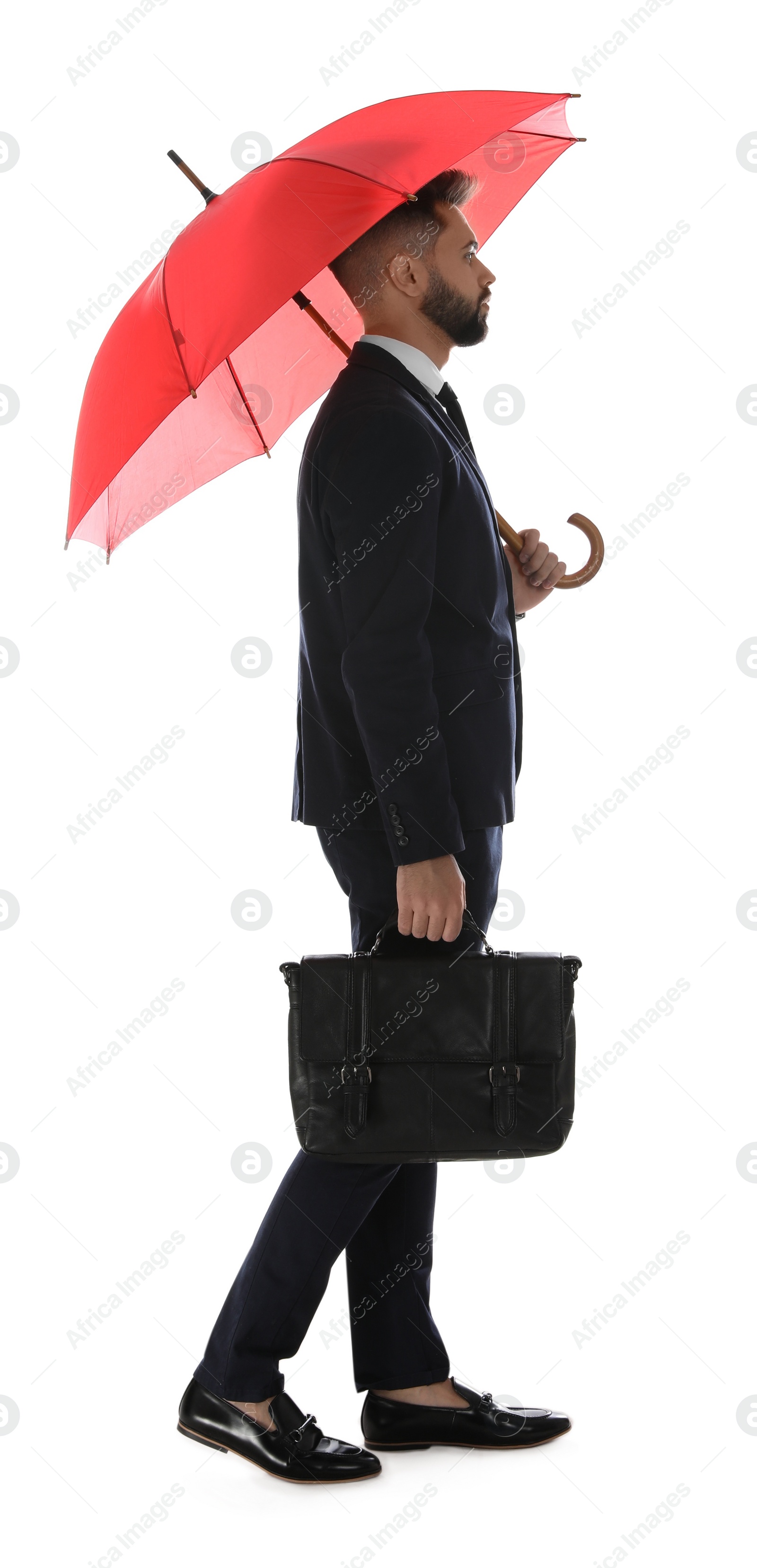 Photo of Businessman with red umbrella on white background