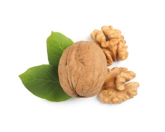 Photo of Fresh ripe walnuts and leaves on white background, top view