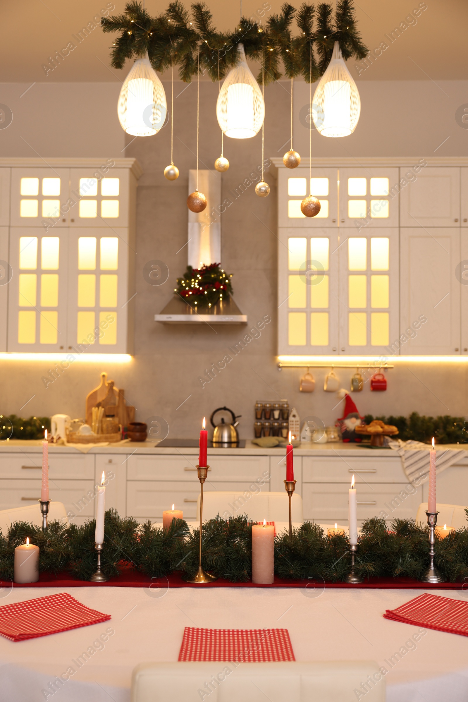 Photo of Cozy spacious kitchen decorated for Christmas. Interior design