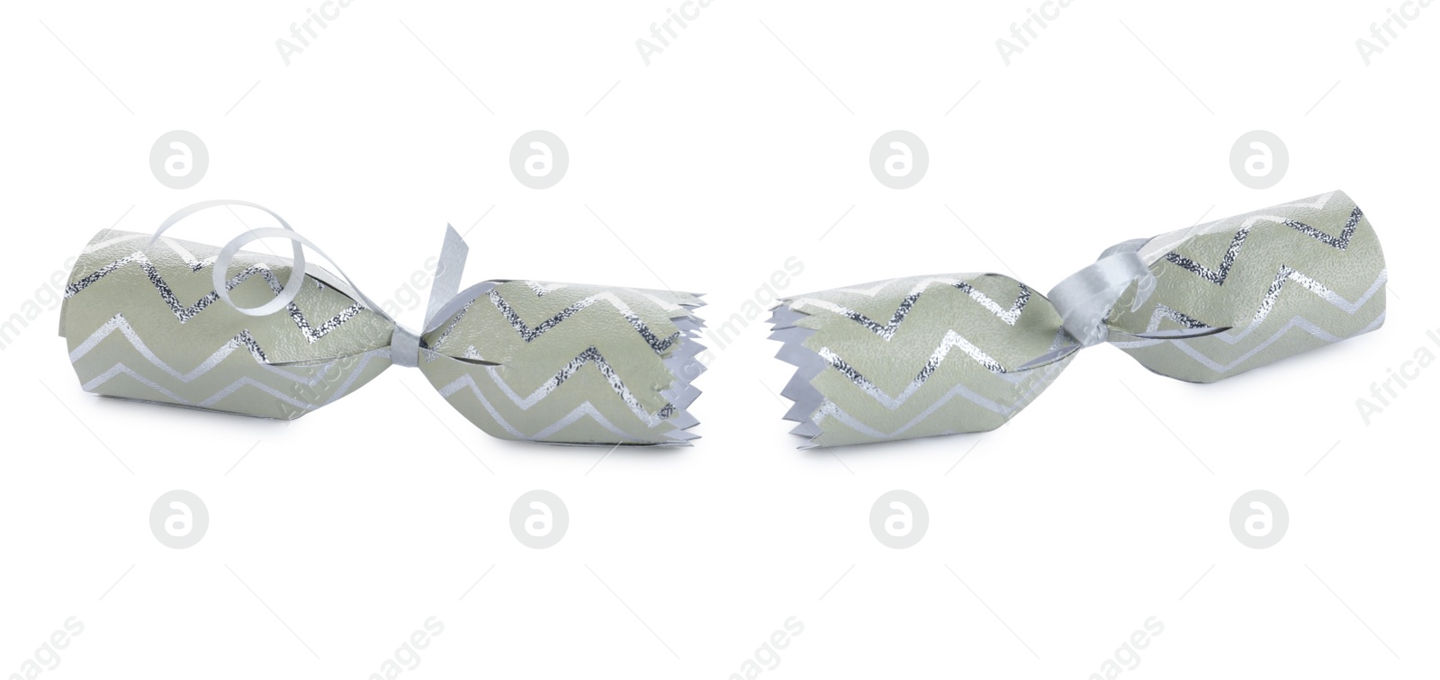 Photo of Open Christmas cracker isolated on white. Festive decoration