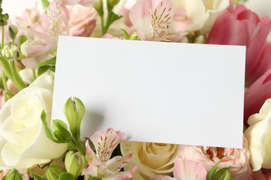 Photo of Happy Mother's Day. Beautiful flowers with blank card, closeup