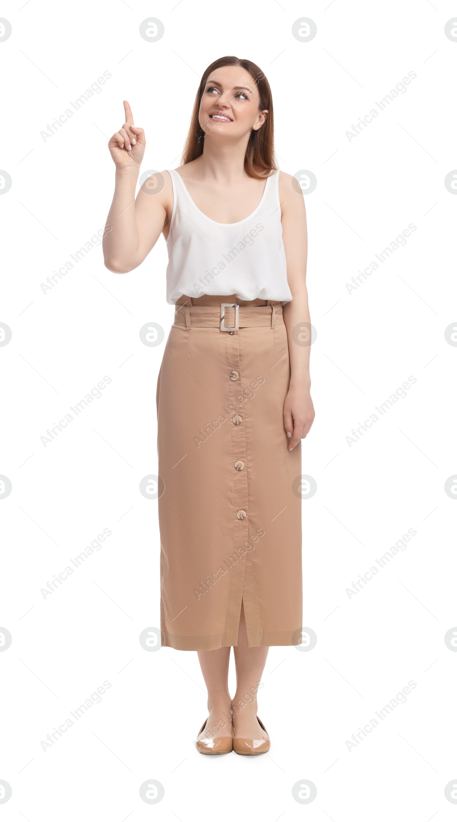 Photo of Beautiful businesswoman pointing at something on white background