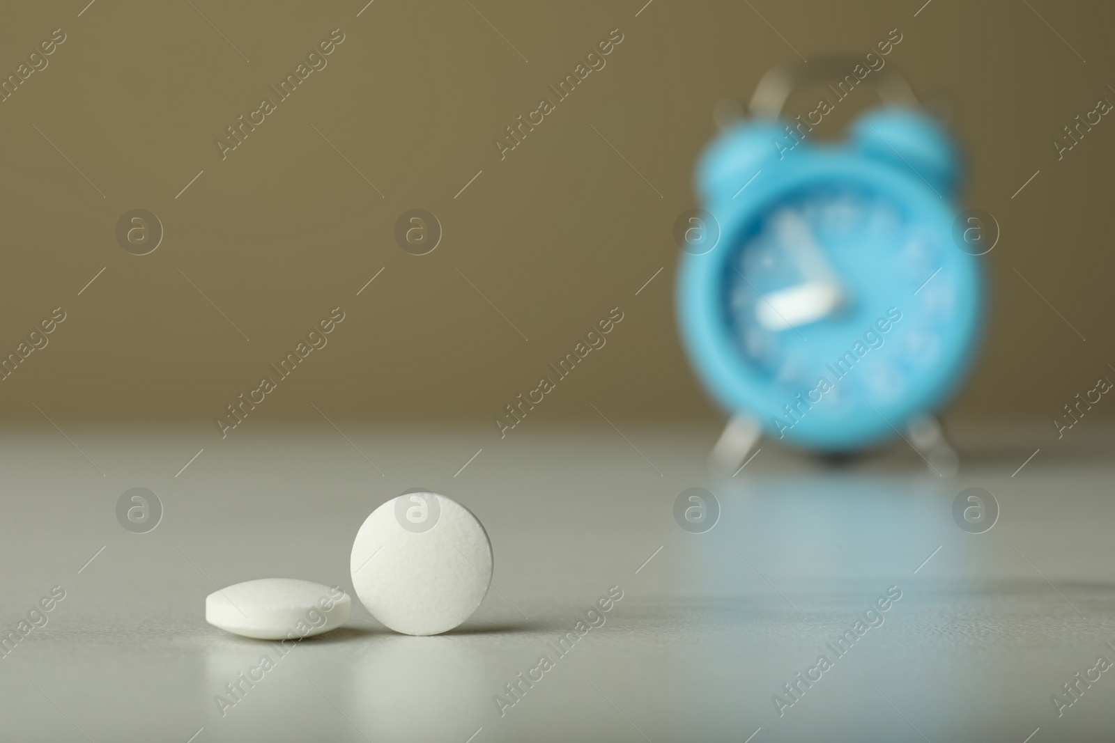 Photo of Pills on white table, closeup with space for text. Menopause concept