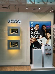 WARSAW, POLAND - JULY 17, 2022: Ecco store window display with shoes in shopping mall