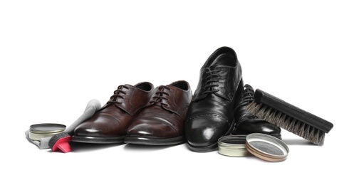 Photo of Stylish men's footwear and shoe care accessories on white background