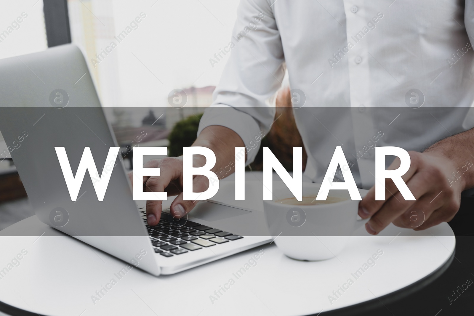 Image of Man working with laptop in outdoor cafe, closeup. Business webinar