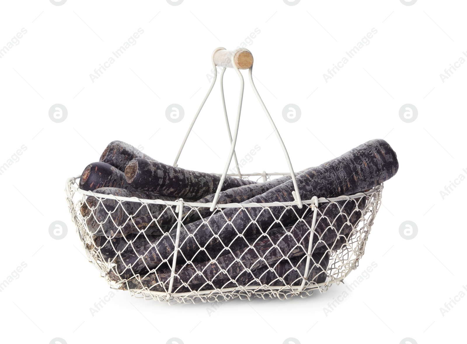 Photo of Raw black carrots in metal basket isolated on white