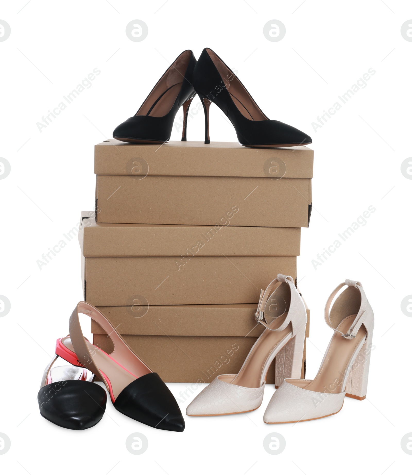 Photo of Different stylish shoes and cardboard boxes on white background