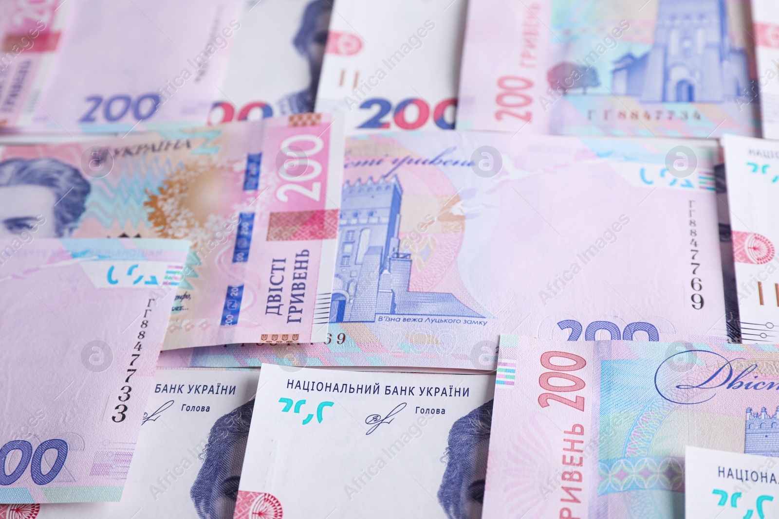 Photo of Closeup view of Ukrainian money as background. National currency