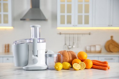 Photo of Modern juicer, fresh vegetables and fruits on table in kitchen