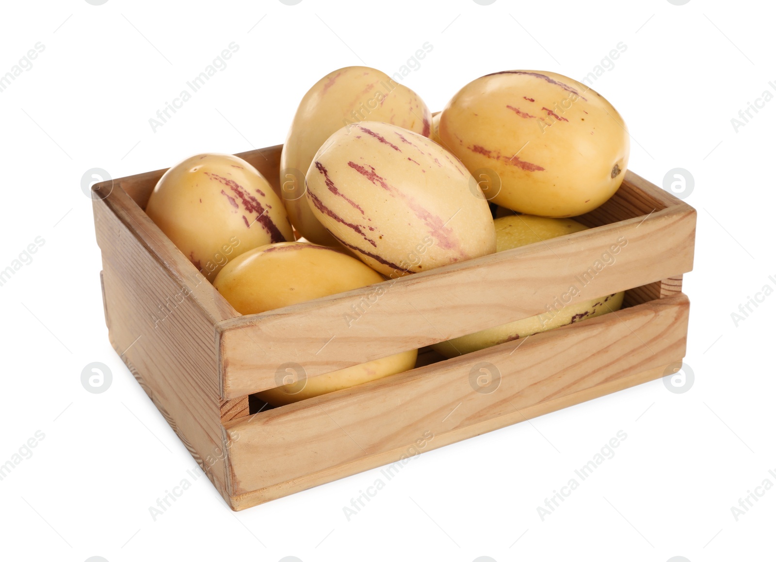 Photo of Fresh ripe pepino melons in wooden crate on white background