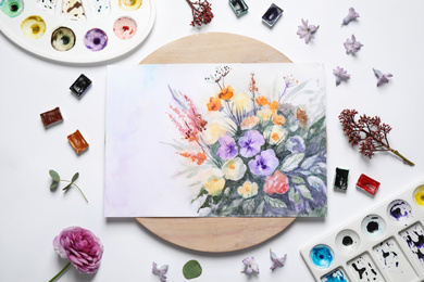 Photo of Flat lay composition with floral picture and watercolor paints on white background