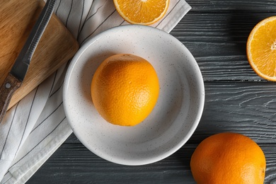 Flat lay composition with fresh oranges on wooden table