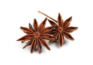 Photo of Dry anise stars with seeds on white background