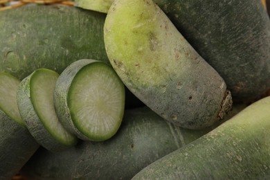 Photo of Ripe green daikon radishes as background, closeup