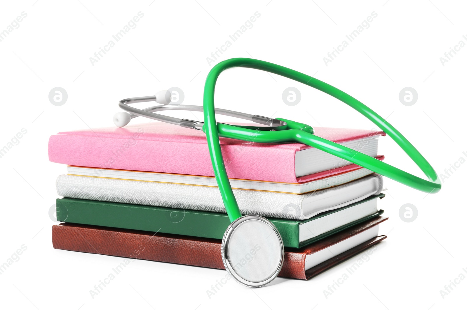 Photo of Stethoscope and notebooks on white background. Medical students stuff