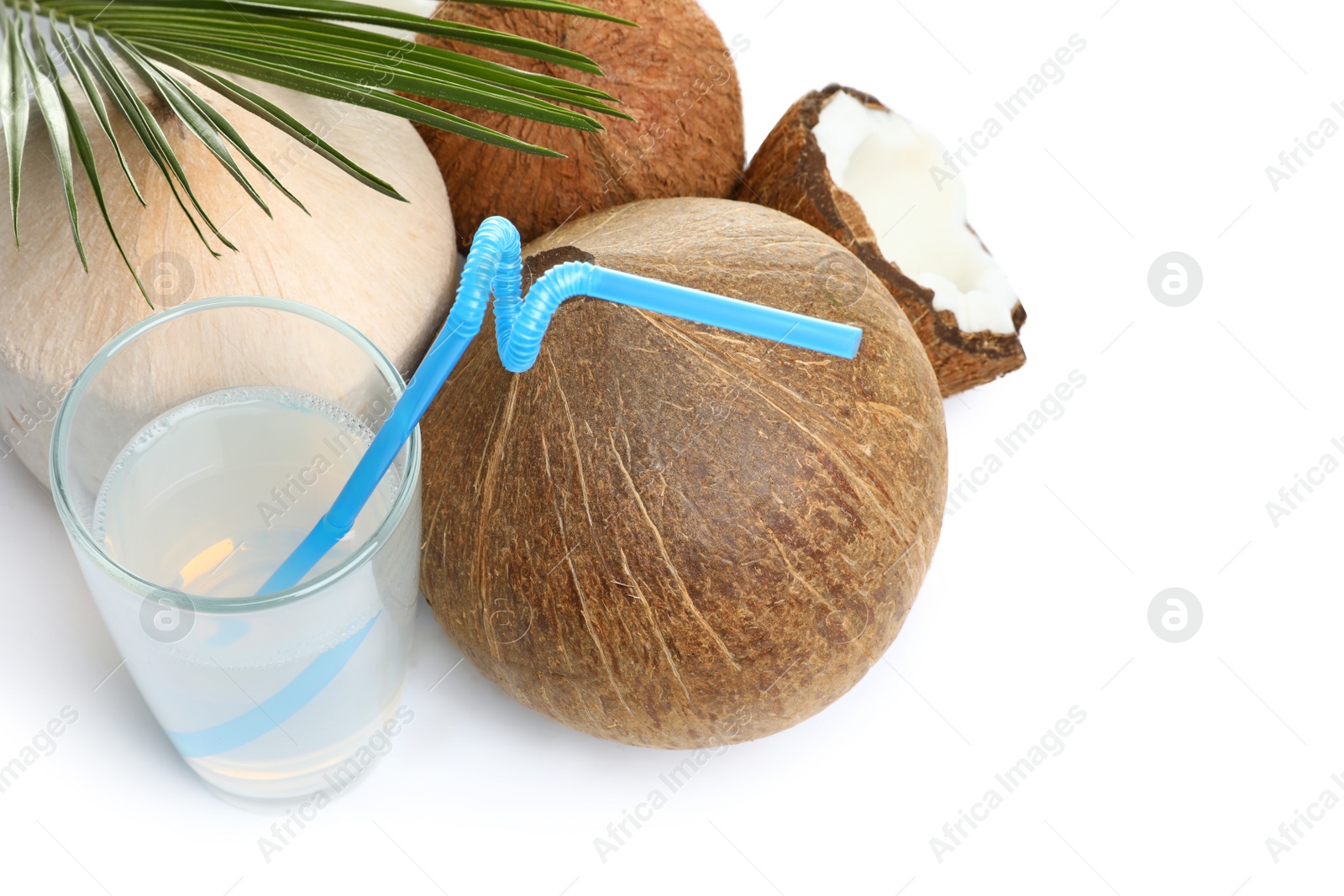 Photo of Glass of coconut milk and nuts on white background