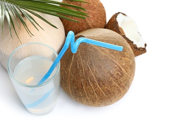 Photo of Glass of coconut milk and nuts on white background