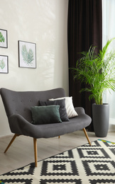 Photo of Comfortable sofa in room. Idea for interior design