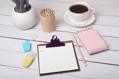 To do notes, stationery and coffee on white wooden table. Planning concept